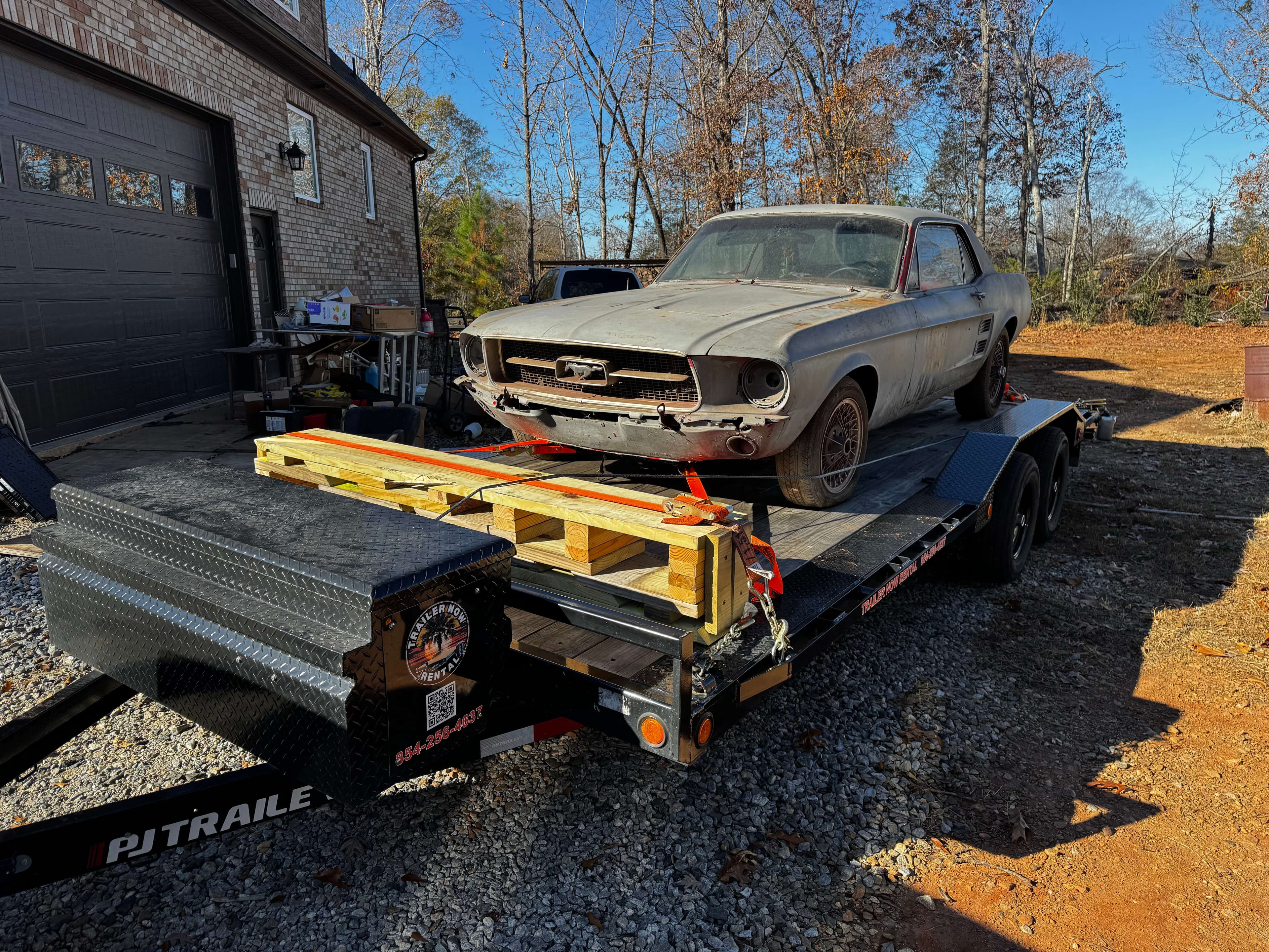 Vintage gray Mustang muscle car on car hauler