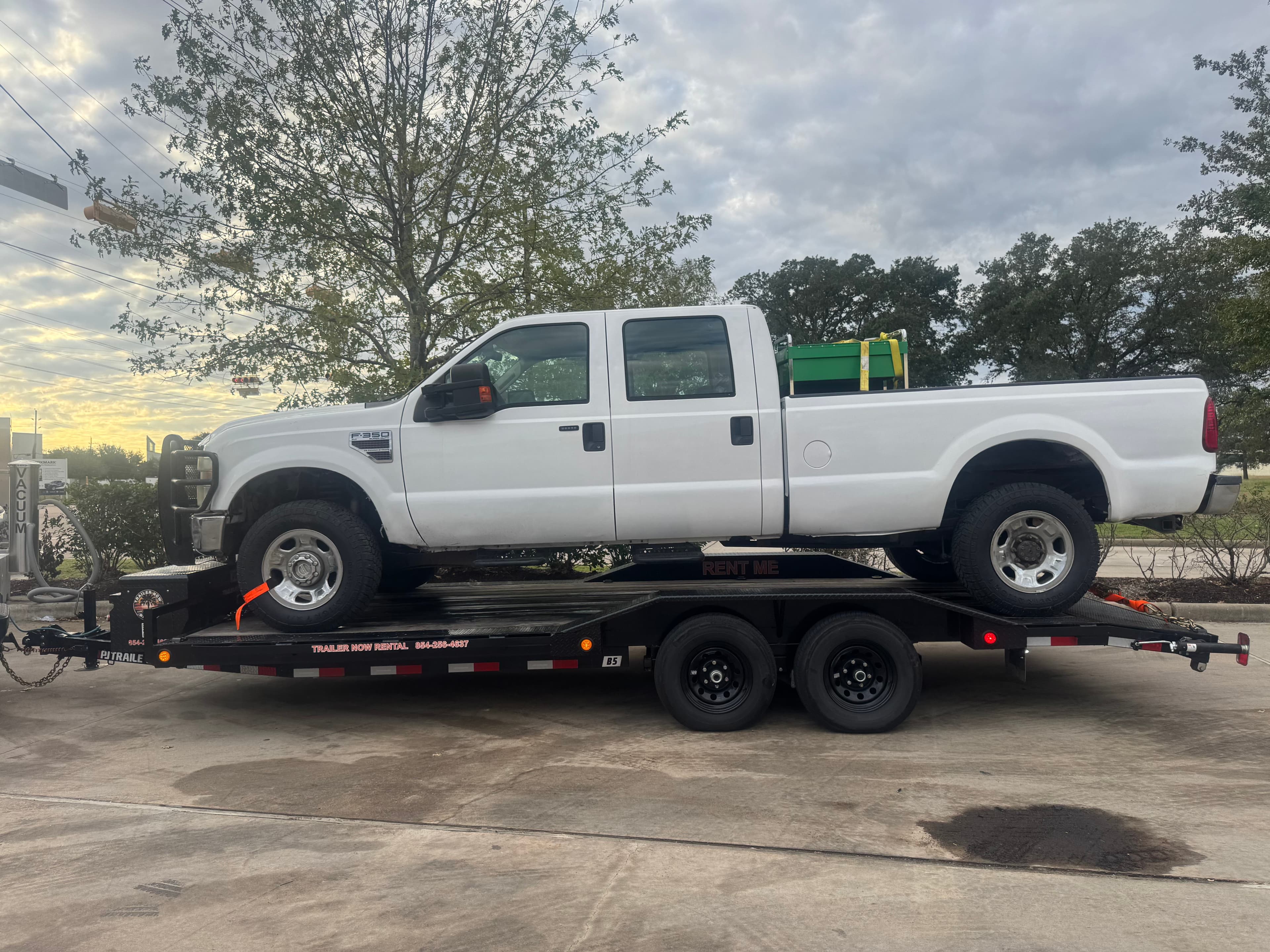 White Ford F-250 on car hauler