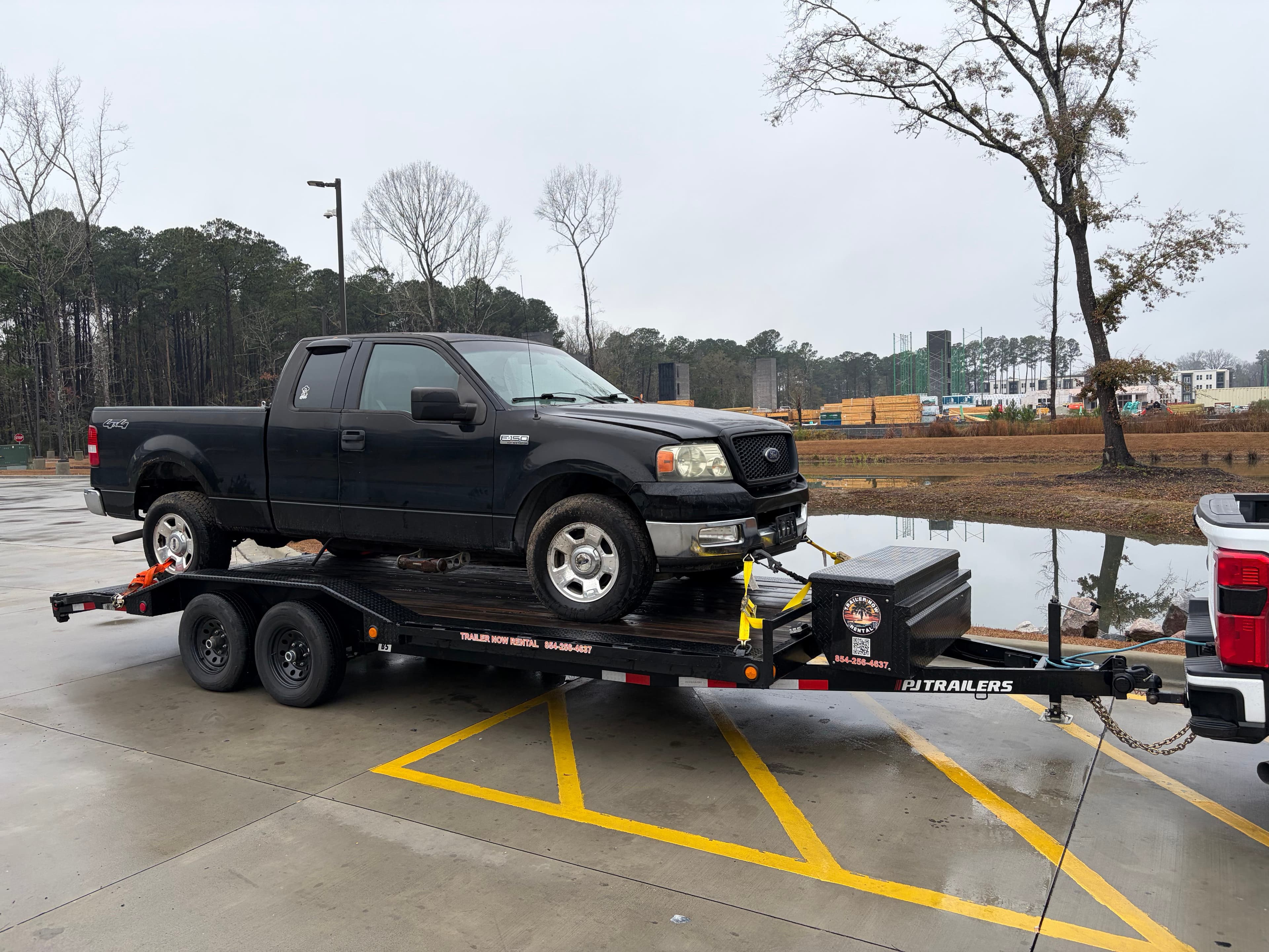 Black Ford F-150 on car hauler